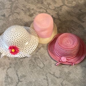 Three kid hats white red and pink